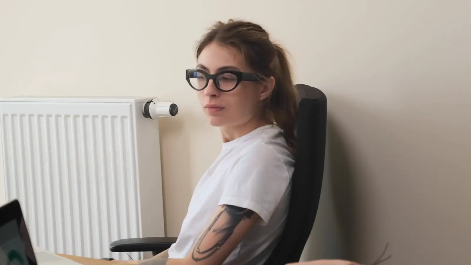 A colleague listening during an office meeting